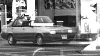 Images reflected in store-front window.